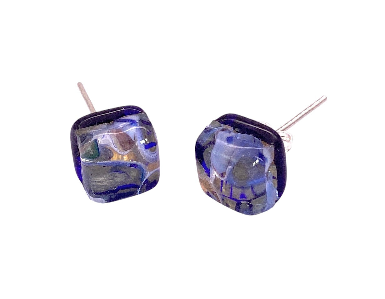 Murano Passion’s Murano Glass Earrings (MGE15) feature dainty 8mm blue and gold glass with abstract swirls, handmade in Venice, Italy.