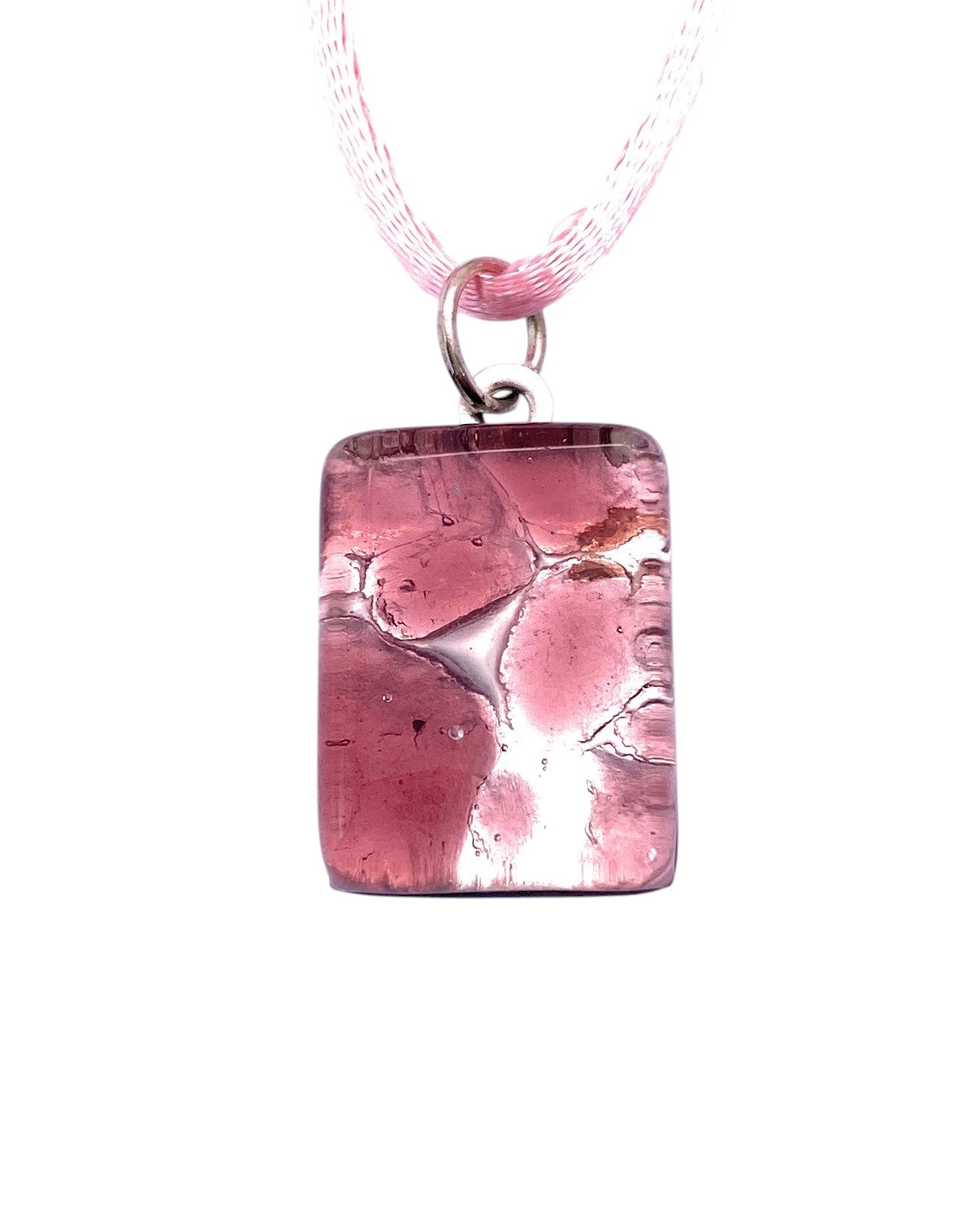 The Murano Passion Murano Glass Pendant on Silver Leaf (Dainty 2cm x 1.5cm, MGPP22) features pink glass with bubble patterns, a silver loop, and sheer pink ribbon. Presented on white and includes a Certificate of Authenticity.