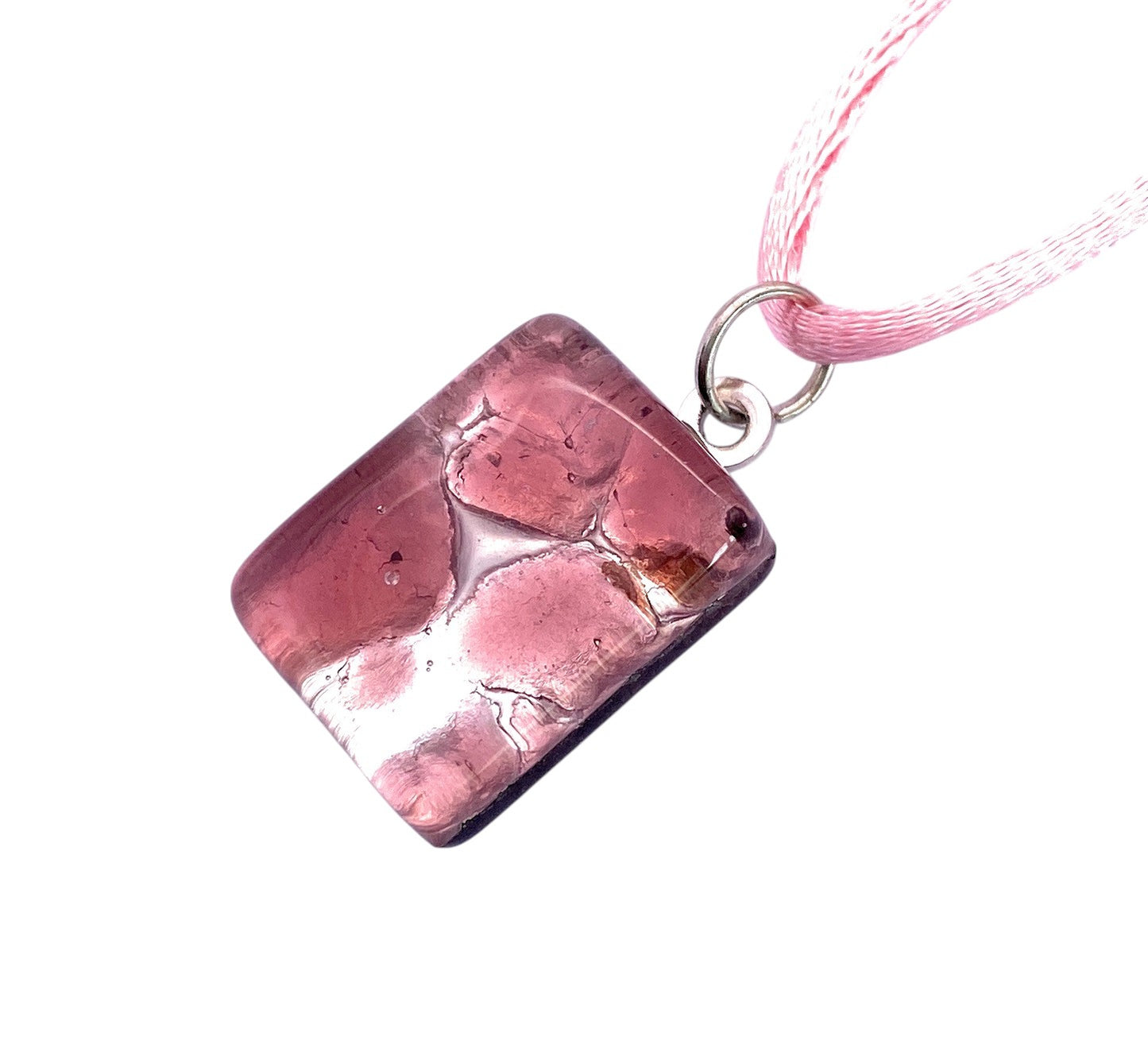 The Murano Passion Murano Glass Pendant on Silver Leaf (2cm x 1.5cm, MGPP22) features a rectangular pink design with visible bubbles, set on a silver ring and light pink cord. Displayed on white background and includes Certificate of Authenticity.