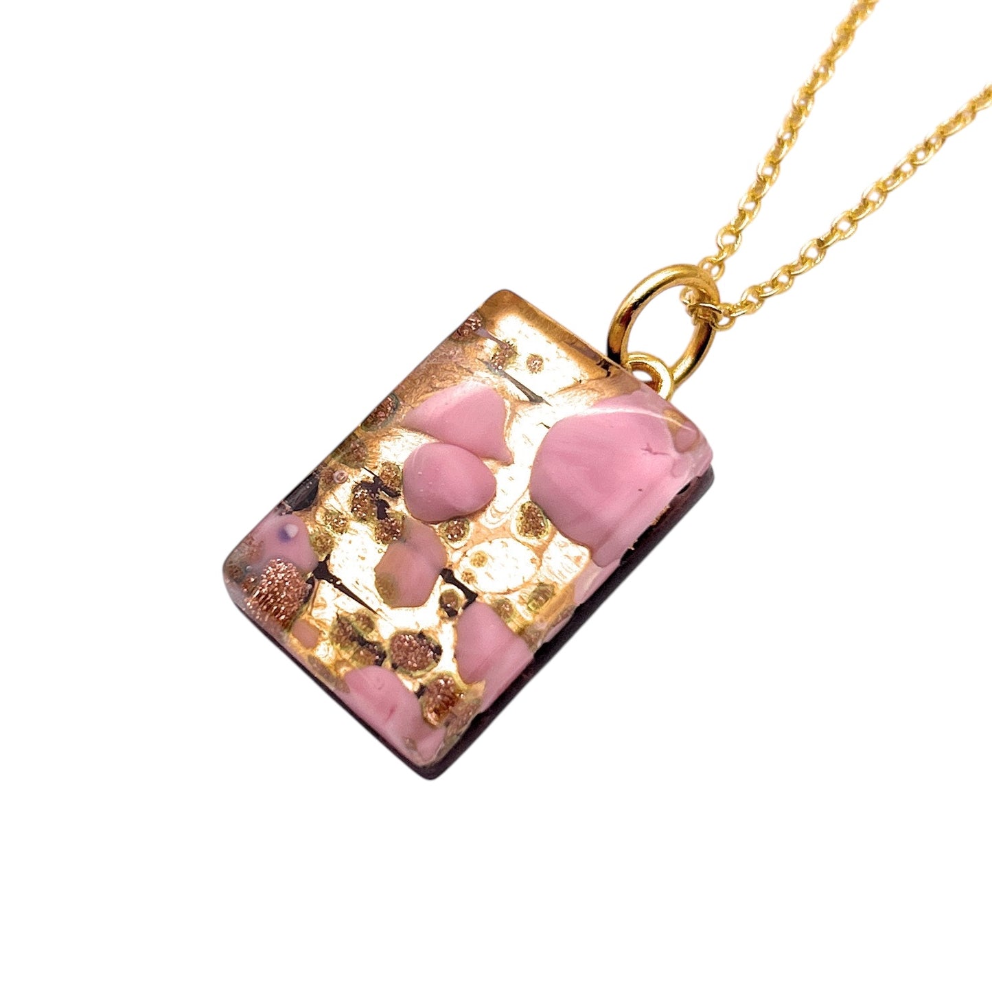 The WEBSITE EXCLUSIVE Murano Passion necklace features a rectangular Murano Glass pendant with pink Millefiori on gold leaf, measuring 2.3cm x 1.5cm, hanging from a delicate gold chain and includes a Certificate of Authenticity.