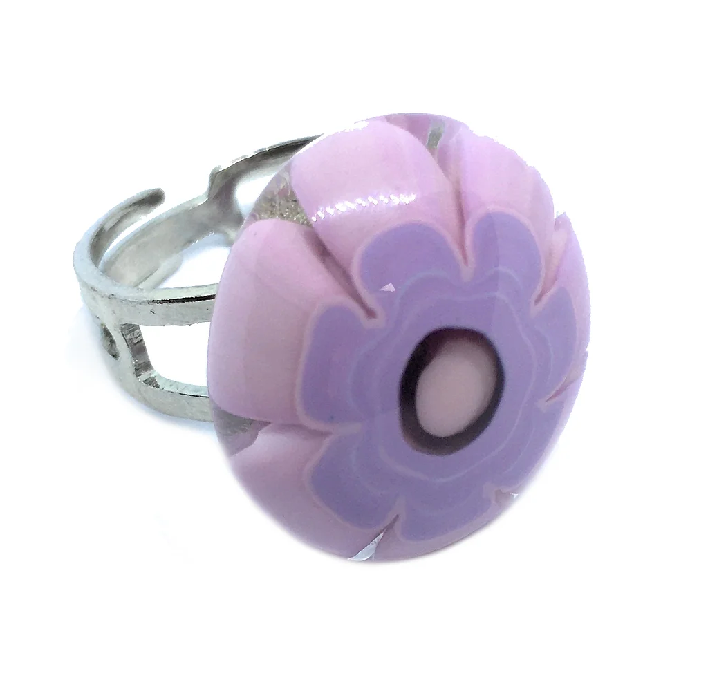 This Murano Passion piece, the Millefiori Flower Ring, measures 2cm x 1.8cm and features a pink and purple flower design with layered petals and a central circular detail, encapsulating the essence of Venetian artistry.