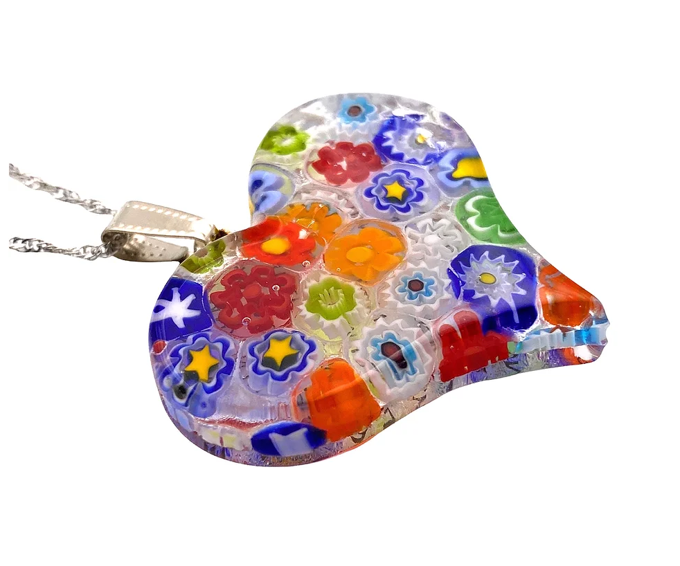 This exquisite Murano Passion Millefiori Heart Pendant, measuring 4cm x 3.5cm, features vibrant floral designs in red, blue, orange, yellow, and green. It is attached to a silver chain and comes with a Certificate of Authenticity.