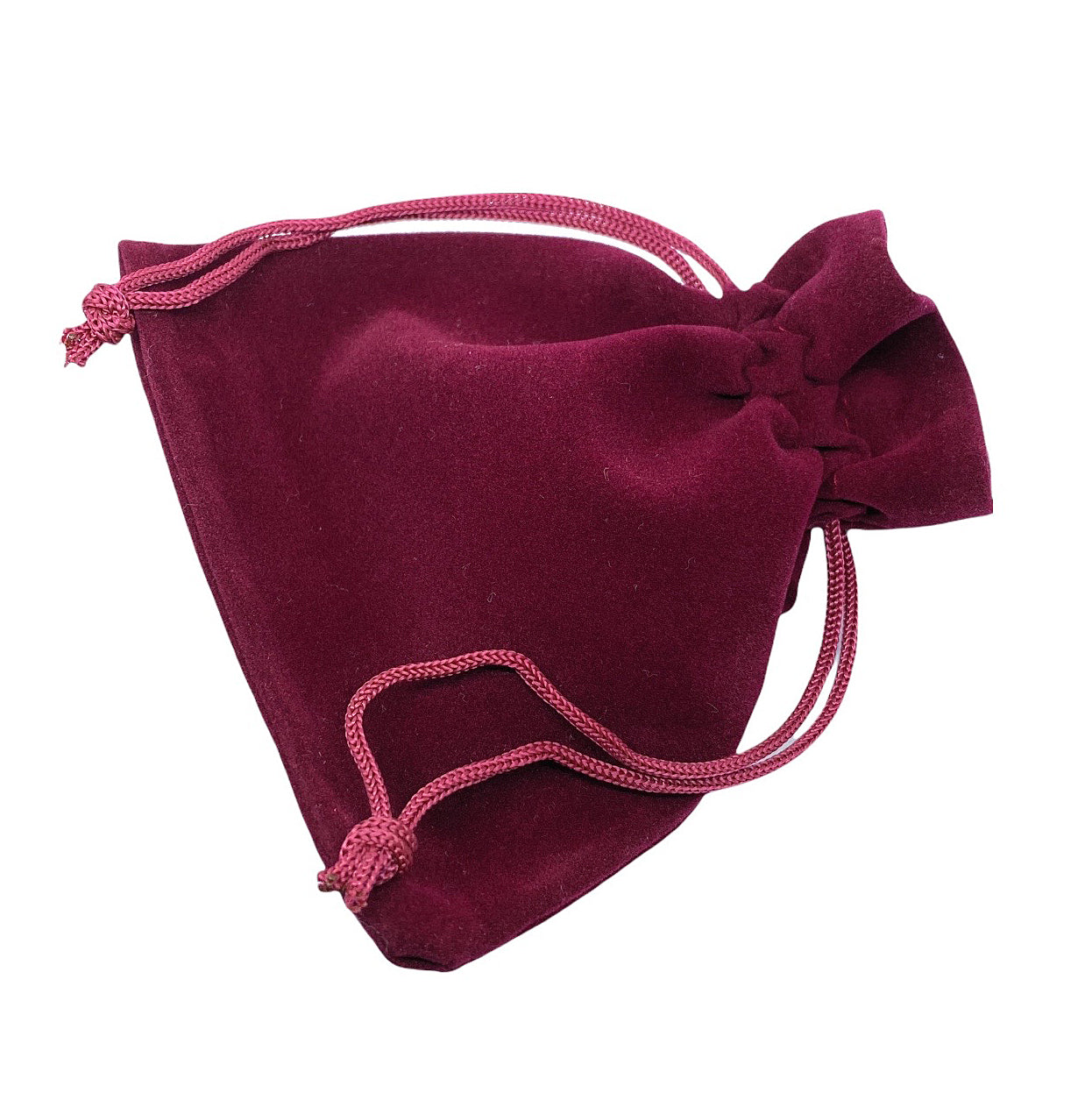 Nestled in a maroon velvet drawstring pouch, the soft shine hints at the treasure within: Murano Passion's Murano Glass Earrings - Pink/Silver, dainty at 8mm diameter. The tied drawstrings suggest an elegant mystery beneath the light.
