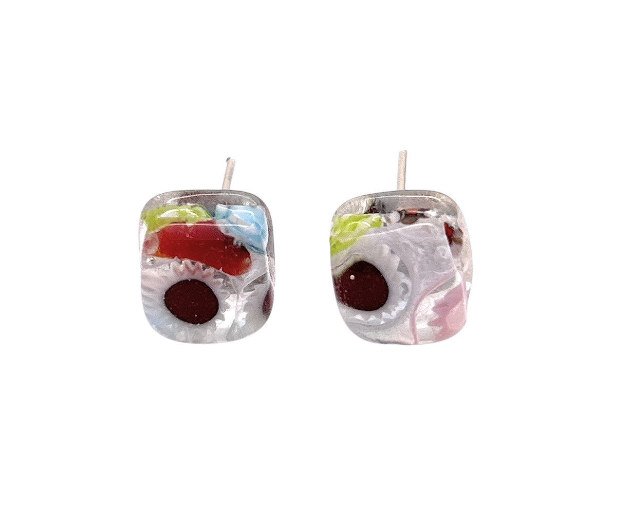 Murano Passion's WEBSITE EXCLUSIVE earrings feature vibrant 8mm Millefiori Murano Glass studs with swirling red, blue, green, pink, and white abstract patterns on a transparent base and a unique central circular design.