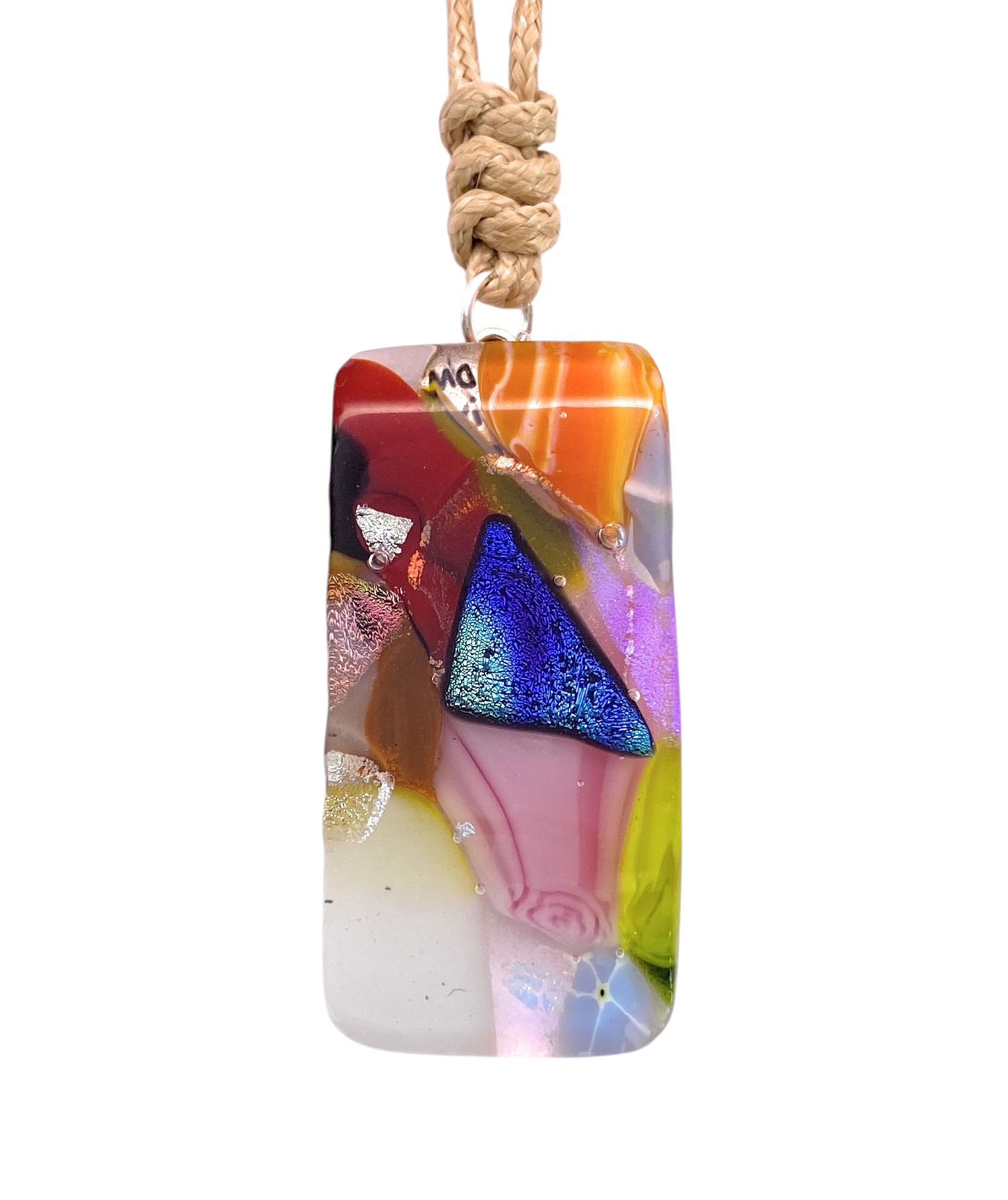 Introducing the “Handmade Dichroic Glass Mosaic Pendant – Multicolour Fused Glass Statement Necklace (CGP84)” by Calon Glass—a stunning rectangular pendant crafted with layers of vibrant dichroic glass in shades of red, blue, pink, orange, green, and purple. Suspended from a beige cord, this handcrafted piece features an abstract design with geometric patterns and a brilliant, reflective surface—making it an eye-catching example of multicolour abstract jewellery.