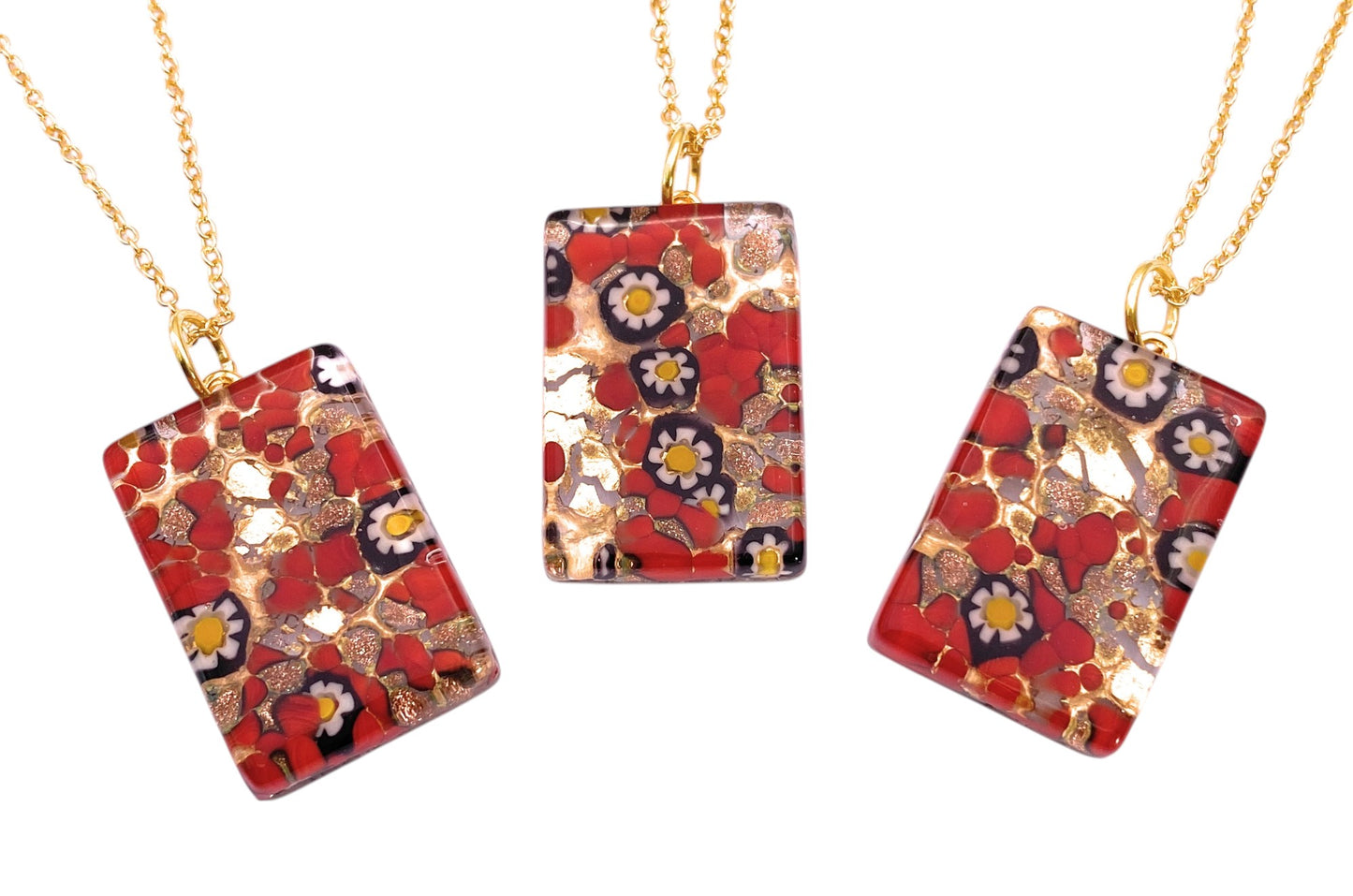 Three Murano Passion gold chain necklaces, each with a 3cm x 2cm Millefiori Flower Murano Glass Pendant (MGPC5) in red, white, and yellow floral designs with gold leaf accents—an elegant example of Murano jewellery.