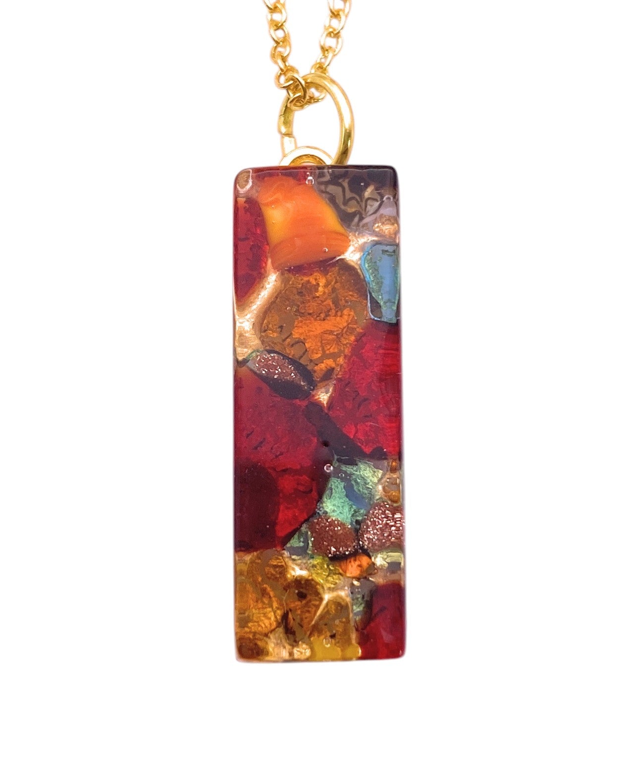 The Murano Passion MGPL8 pendant (3cm x 1cm) features gold leaf and vibrant resin with colorful Murano Glass in red, yellow, orange, green, and blue for a striking abstract design on a rectangular gold chain.