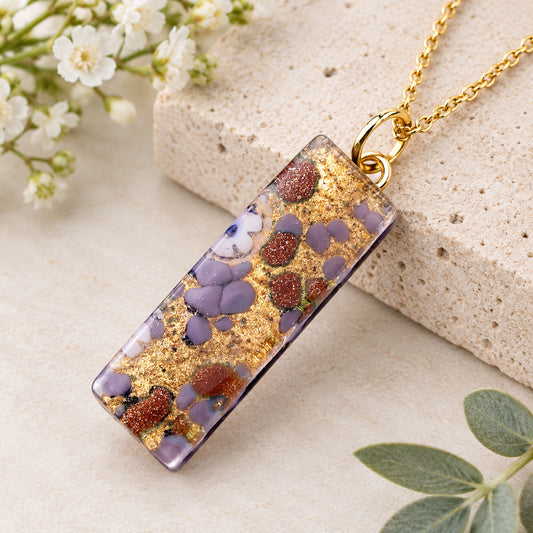 Murano Glass Pendant made using Gold Leaf - 3cm x 1cm (MGPL13) with purple, glittery brown, and gold leaf on a gold chain.