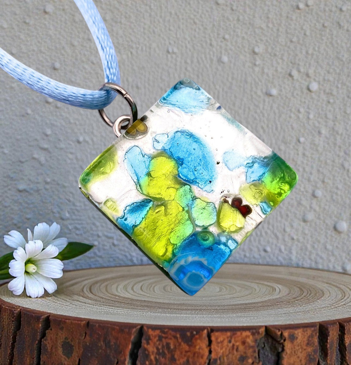Murano Glass Pendant on Silver Leaf, 2cm x 2cm (MGPD11), a square pendant with blue and yellow millefiori on a blue cord.