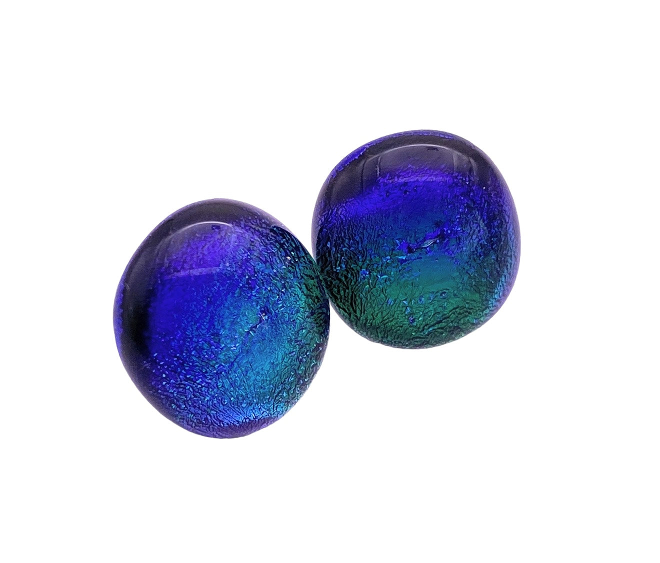 Placed against a plain white background are two spherical items reflecting a blue and green gradient, reminiscent of the Handmade Dichroic Glass Earrings by Calon Glass, sized at 1.4cm.