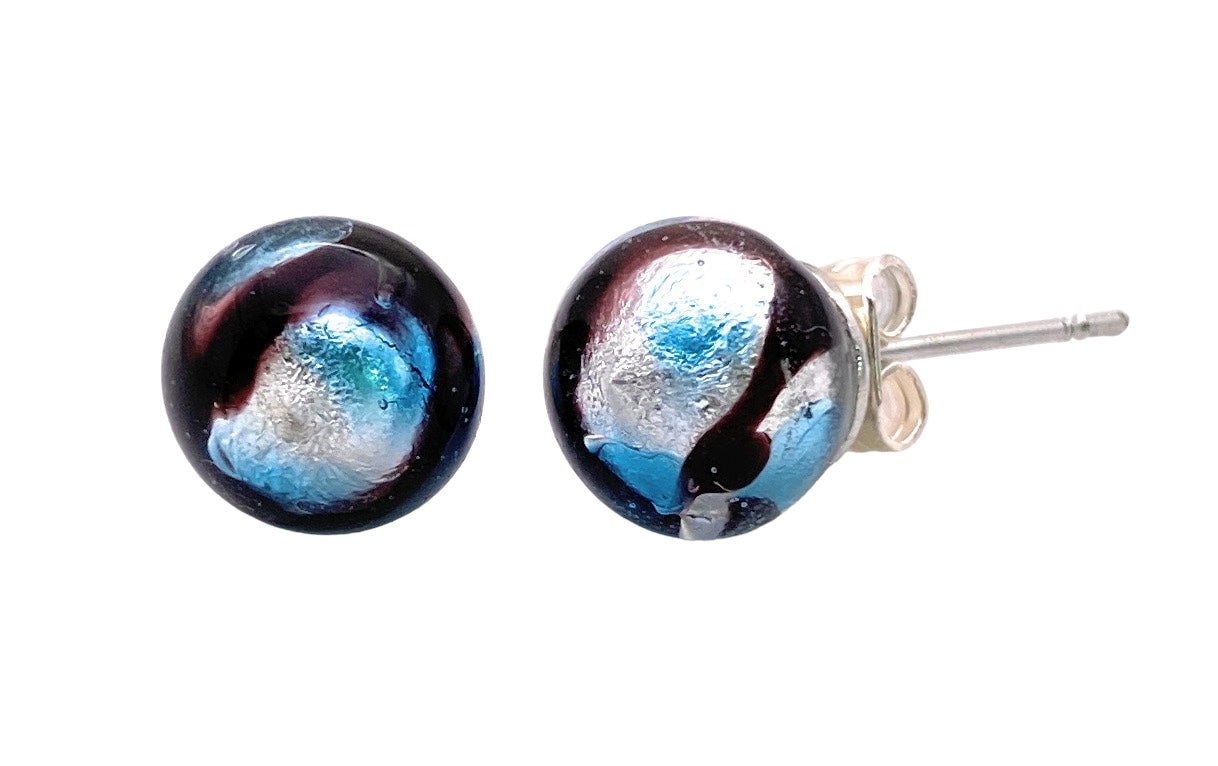 Close-up of a pair of Murano Passion's Murano Glass Earrings (MGE14) showcasing 8mm round beads with a glossy marbled design in shades of blue, silver, and black. These exquisite beads are set on silver-plated studs with butterfly backings, adding an elegant touch to any Murano Glass Jewelry collection.