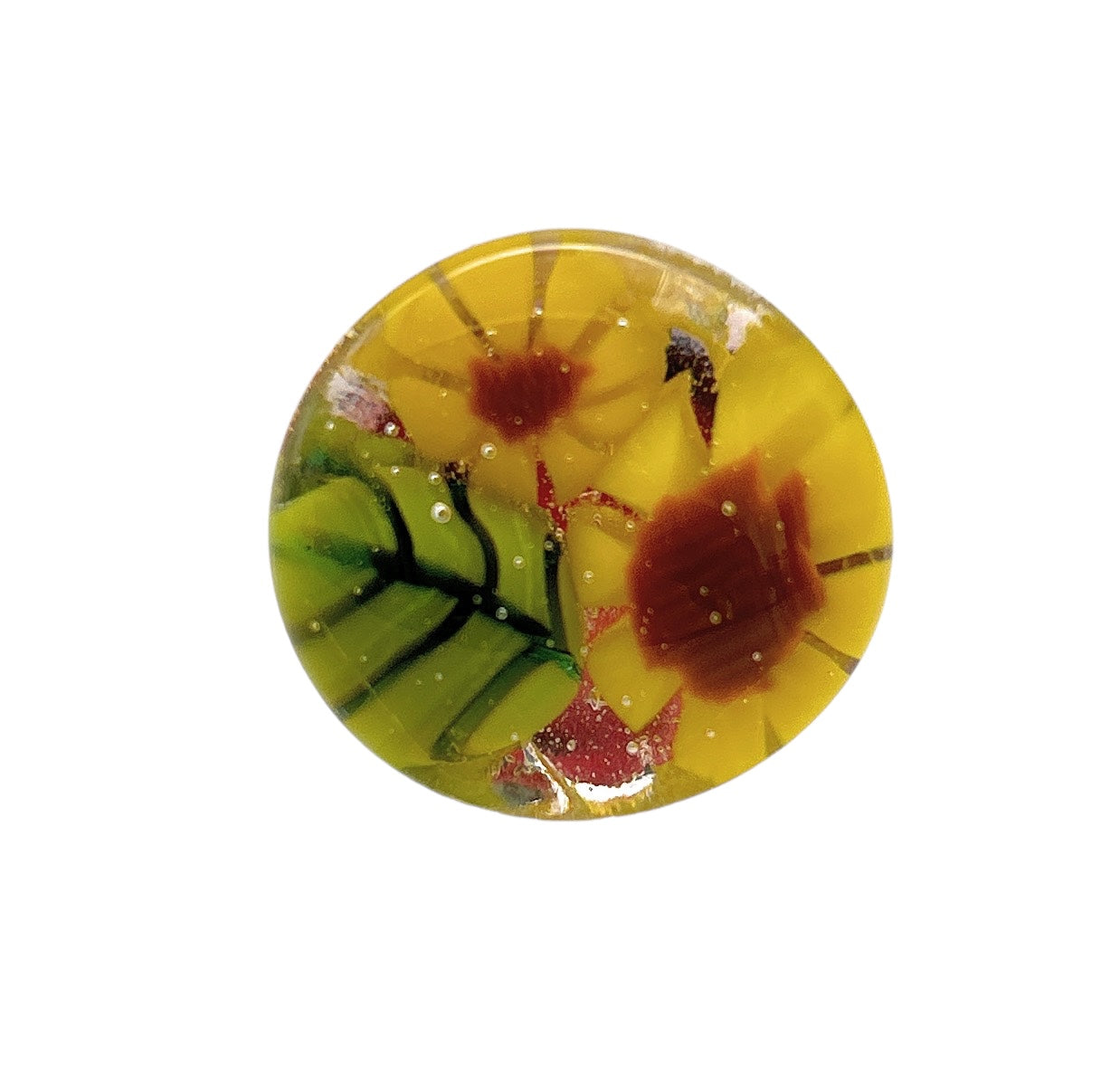 This handmade glass ring, known as the Sunflower Ring by Calon Glass, features a stunning floral design with large yellow and orange flowers adorned with vibrant green leaf accents. Set against a clear backdrop, it echoes the beauty of classic Millefiori pieces.