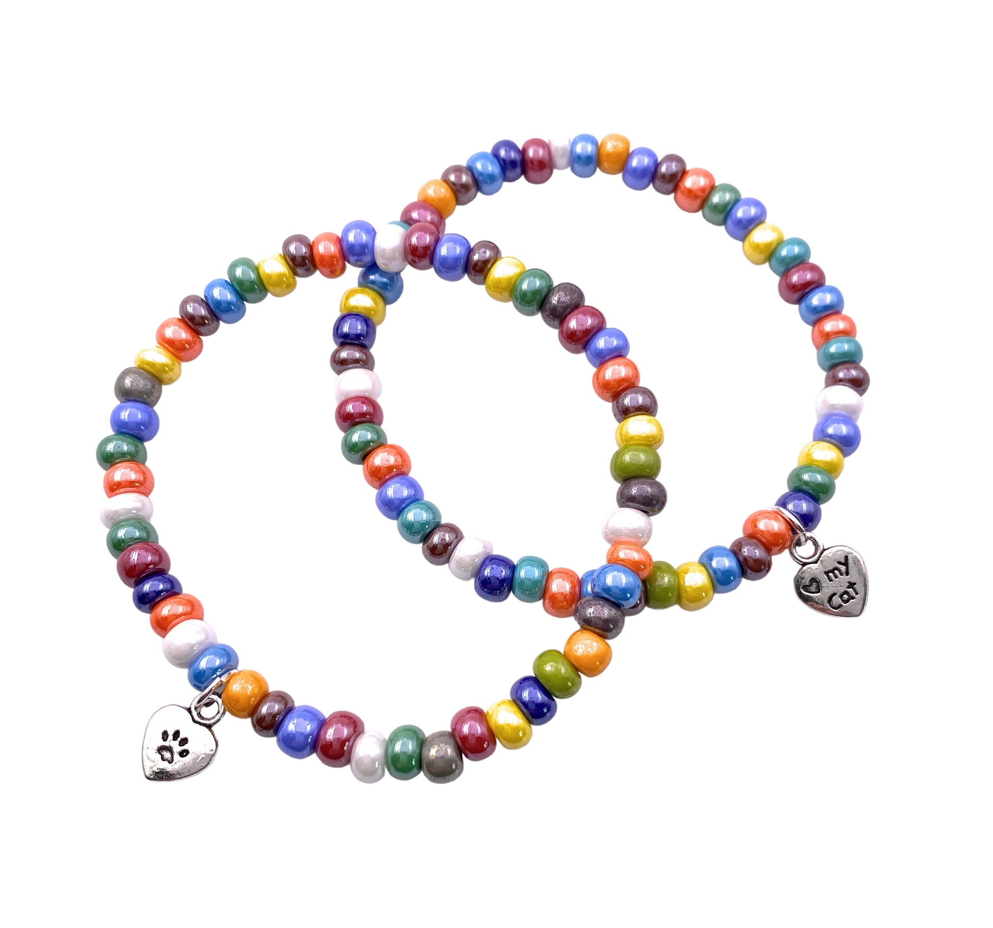 Enjoy a pair of vibrant Murano Passion bracelets, each decorated with authentic 5mm/0.5cm multi-colored Murano glass beads. One bracelet features a silver heart charm adorned with a paw print, while the other showcases a silver heart inscribed with "my cat." These elasticated bracelets beautifully encapsulate the unique allure of handmade Murano jewelry.