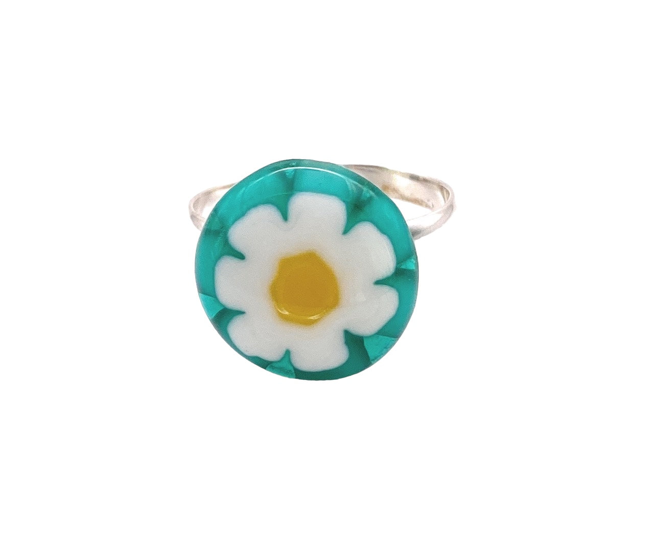 Introducing the Handmade Millefiori Glass Ring by Calon Glass: a dainty 1.4 cm silver ring showcasing a round, vibrant resin design inspired by Millefiori glass, with a white daisy and yellow center set against a turquoise background.