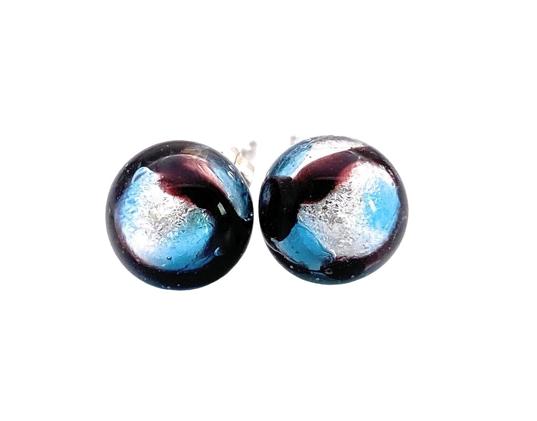 Close-up of Murano Passion's 8mm Murano Glass Earrings (MGE14), featuring a captivating swirling design in black, blue, and silver tones with a glossy finish. Each exquisite piece embodies the elegance of Murano Glass Jewellery and includes a Certificate of Authenticity.