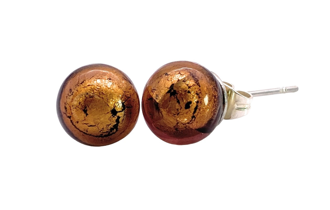 Introducing the Murano Passion Murano Glass Earrings (MGE13), featuring a stunning 8mm round design with a gold and copper marbled pattern reminiscent of exquisite handmade jewelry. These earrings are set on silver plated studs and boast a shiny, reflective surface.