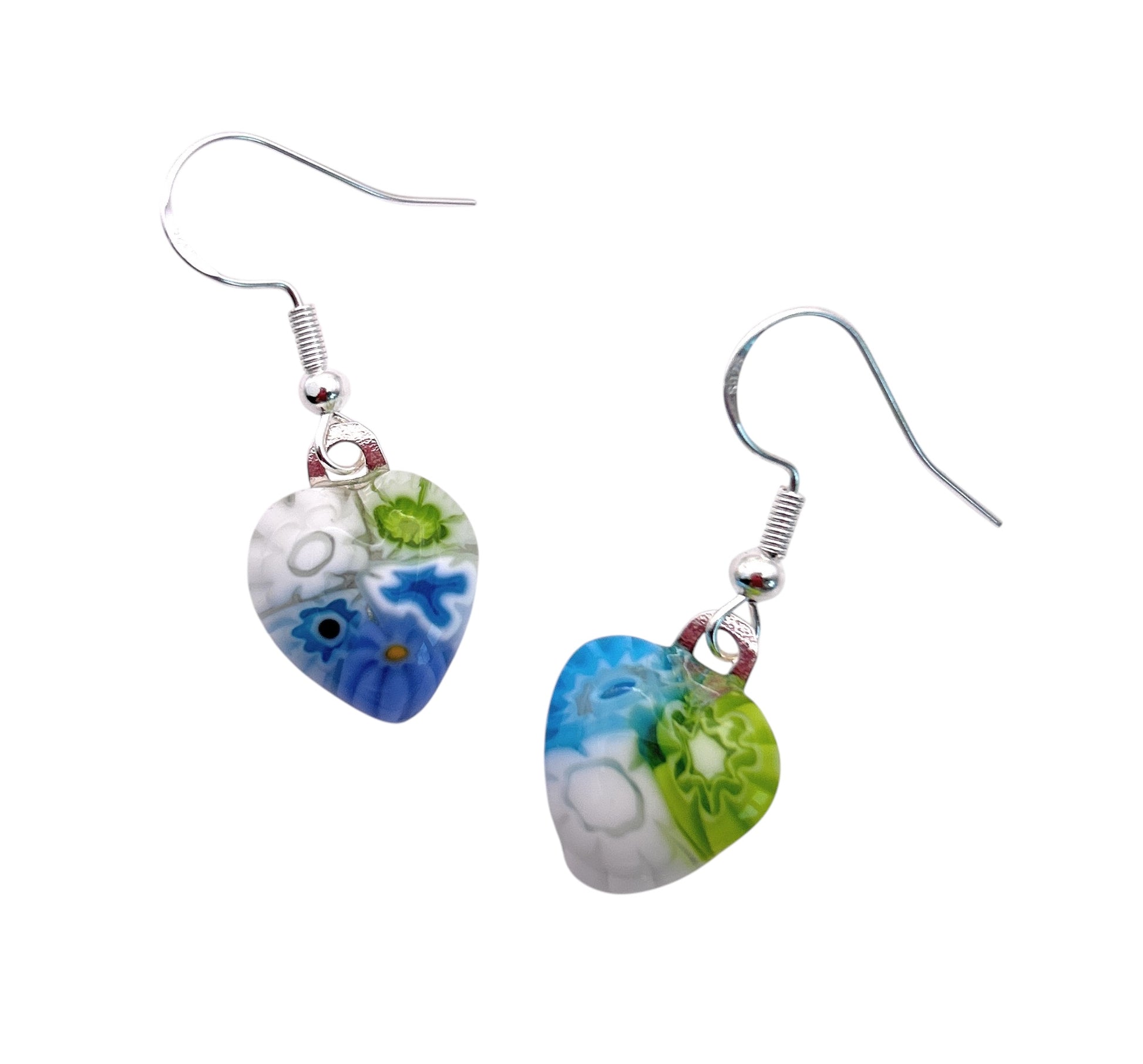 Two drop earrings feature heart-shaped glass with colorful floral designs in blue, green, and white. The earrings have sterling silver hooks.