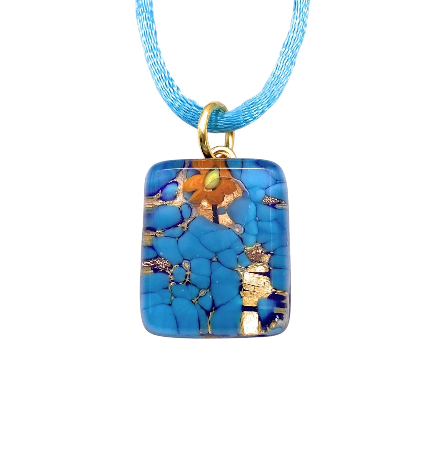 A Murano Passion Murano Glass Pendant, named MGPP28, features a turquoise and gold marbled design on a blue cord. This dainty 2cm x 1.5cm rectangular charm showcases vibrant blue hues with gold leaf accents for a striking and elegant look. Each piece is accompanied by a Certificate of Authenticity to highlight its genuine craftsmanship.