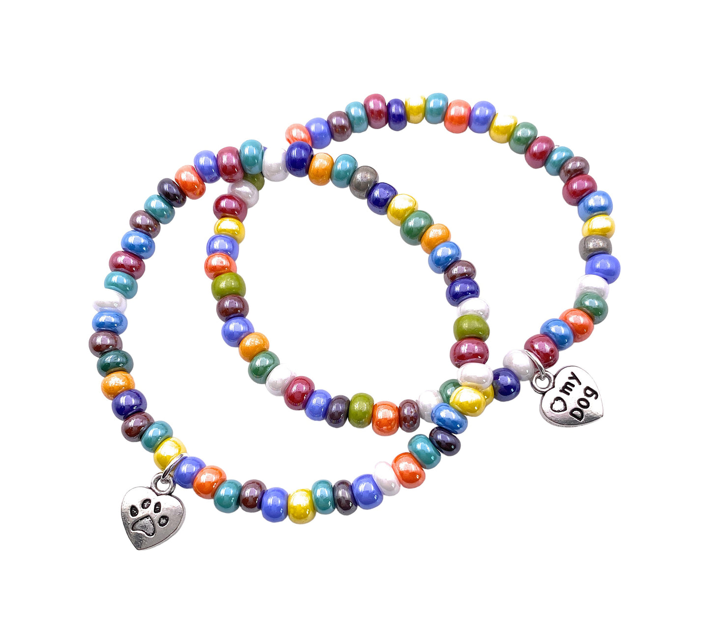 Two vibrant beaded bracelets from Murano Passion are displayed. Each bracelet in this set includes a small, heart-shaped charm—one with a paw print and the other inscribed with "My Dog." The bright, dainty 5mm multi-colored beads capture the lively essence of Murano Glass Jewellery; however, these pieces do not come with a Certificate of Authenticity.