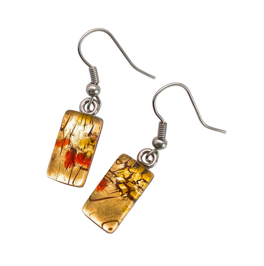 These Murano Passion Earrings feature a pair of rectangular shapes adorned with gold, red, and black abstract patterns and include hooks for hanging. With a glossy finish and metallic sheen, these handcrafted dropper earrings on gold leaf, measuring 1.5cm x 0.8cm, showcase the essence of Venetian Artistic Heritage in every detail.