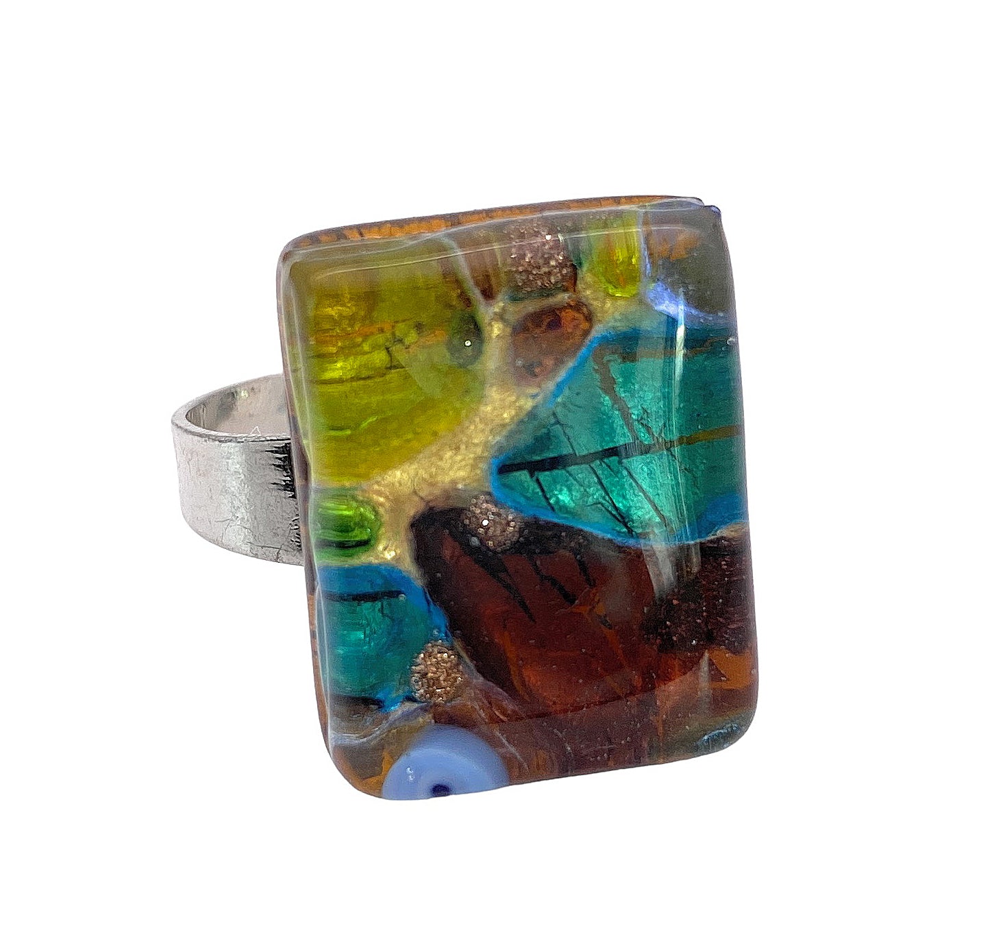 The Murano Passion Murano Glass Ring is adorned with a rectangular multicolored glass top featuring abstract designs in shades of blue, green, brown, and gold. Its silver-toned band beautifully showcases genuine Murano glass, reflecting authentic Italian craftsmanship in every detail. The dimensions of the ring's top are 2cm x 1.5cm.