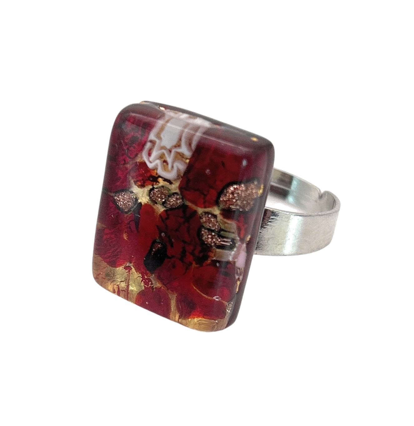 A Murano Passion silver ring features a square-shaped, translucent red stone crafted from genuine Murano glass, adorned with gold and black specks inside. The design highlights a Millefiori flower on gold leaf, measuring 2cm by 1.5cm (MGR2).