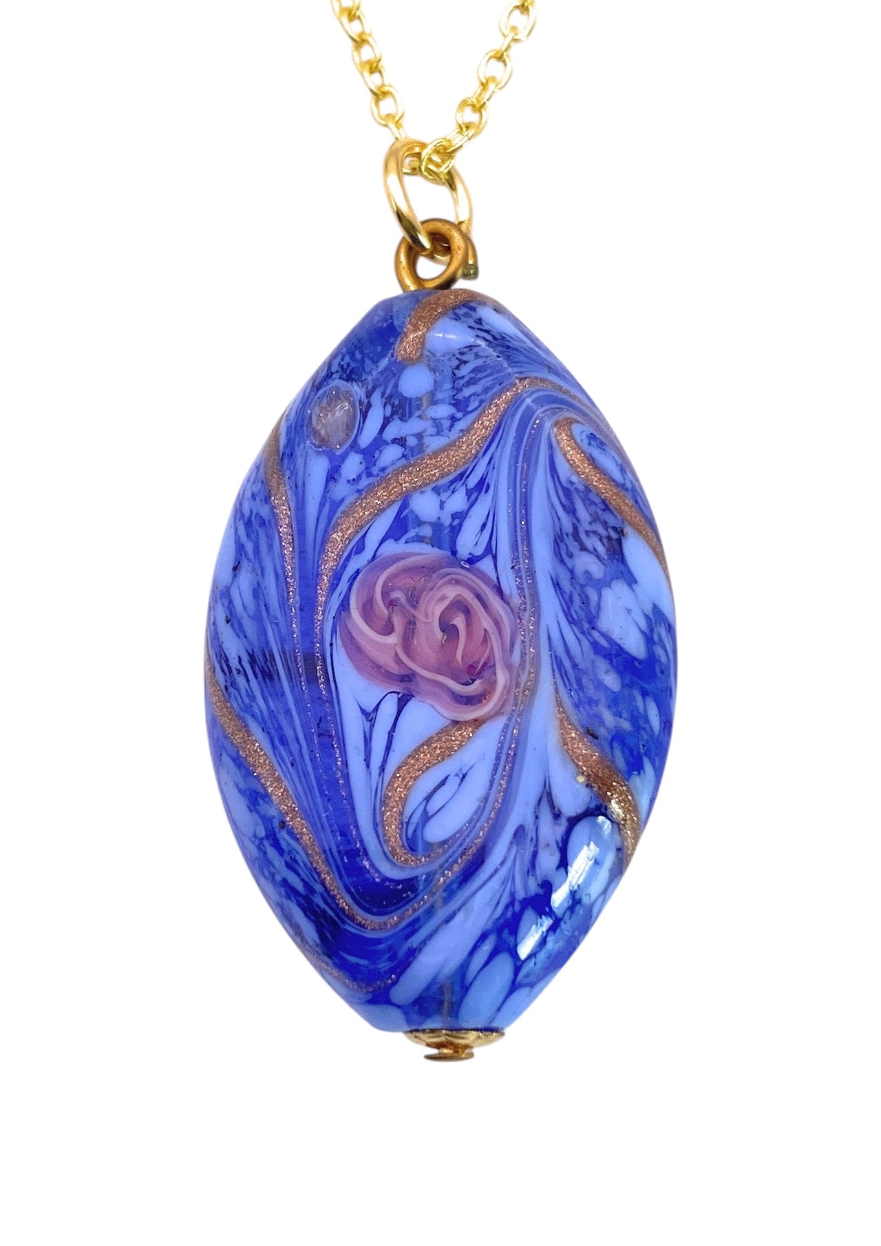 A Murano Passion Murano Glass Pendant, featuring a blue oval-shaped design with swirling gold lines and an embedded pink rose, is elegantly attached to a delicate gold chain, capturing the refined beauty of Murano Glass Jewellery.