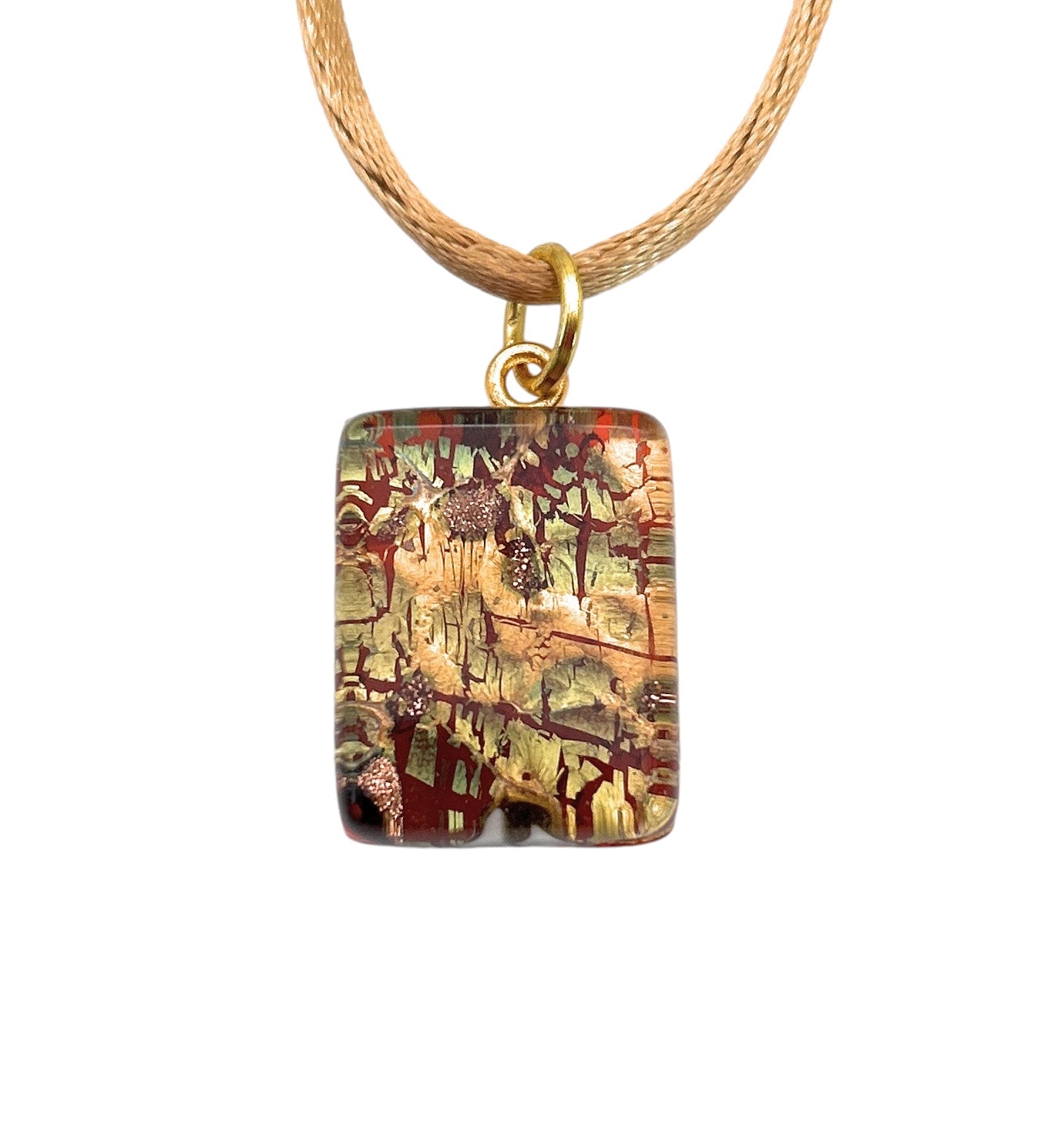 A detailed view of the Murano Glass Pendant, Green on Gold Leaf by Murano Passion, showcases a rectangular charm with abstract patterns in brown, green, and red hues. The elegant design is suspended from a beige cord threaded through a gold-colored ring, perfectly capturing the timeless beauty associated with Murano Glass Jewellery.