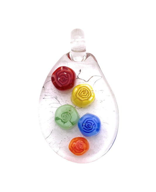 The Flower Pendant by Calon Glass is a handmade, teardrop-shaped glass piece measuring 3cm x 2cm. It features five vibrant, embossed roses in red, green, yellow, blue, and orange arranged vertically on a clear background that highlights the colorful flowers beautifully.