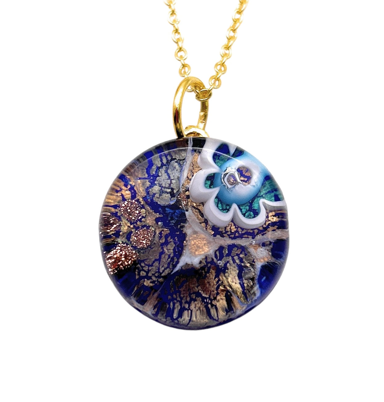 The Murano Glass Round Pendant, crafted with Millefiori Flower and measuring 2cm, dangles from a gold chain. This piece from Murano Passion showcases blue and white floral designs with intricate, luminous patterns for a vibrant, artistic appearance. It is an exquisite Murano Glass Jewelry item that comes with a Certificate of Authenticity.