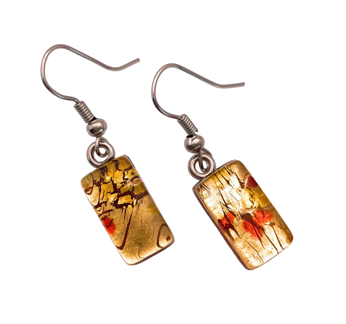 Close-up of Murano Passion's Murano Glass Earrings featuring dangling dropper earrings with rectangular pendants. The design displays a gold and red abstract floral pattern with a metallic texture, beautifully blending Venetian artistic heritage and the elegance of Murano glass. The hooks are silver-colored, adding a sophisticated touch to these exquisite pieces.