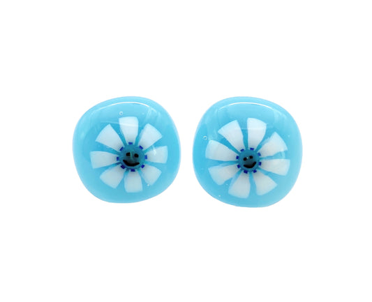 These Calon Glass handmade earrings feature smiley face Millefiori flowers in stunning blue glass, with a white flower design at their center, measuring 1.4cm.