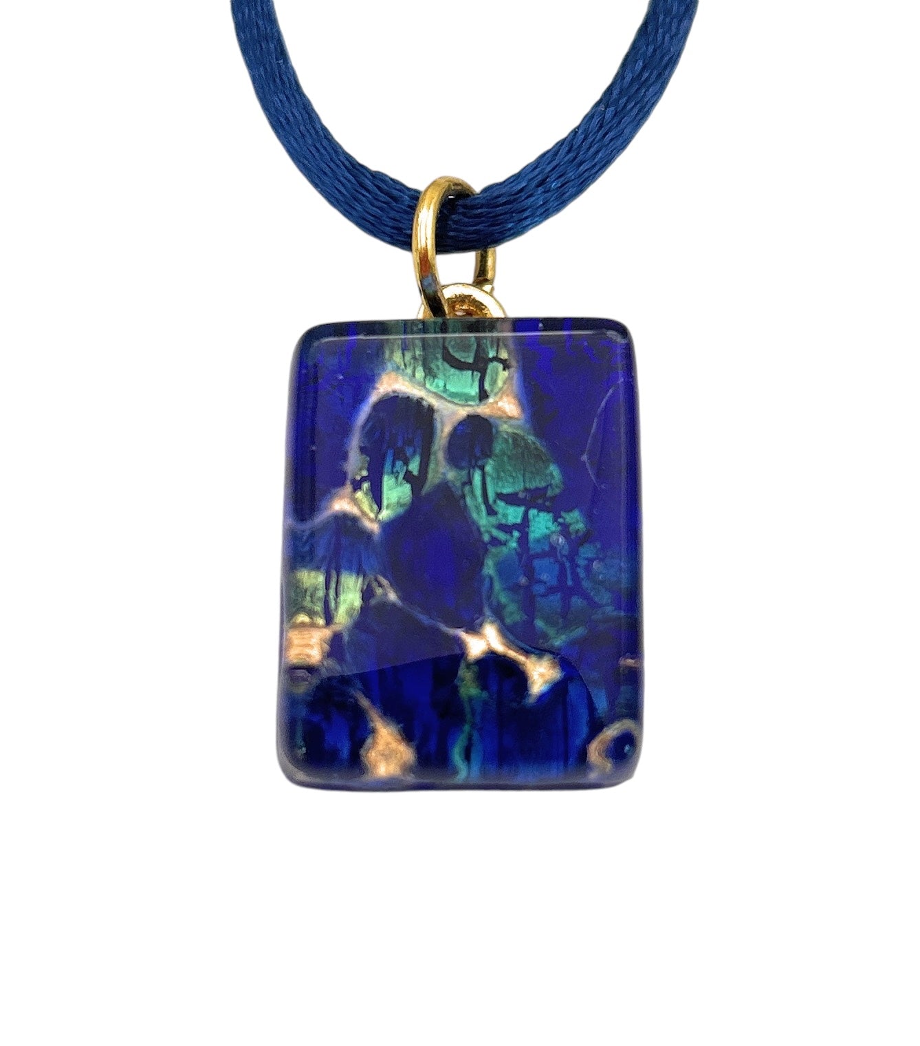 The Murano Passion Murano Glass Pendant, Navy on Gold Leaf - Dainty 2cm x 1.5cm (MGPP16), features an abstract swirling pattern in a rectangular design attached to a blue cord. With hints of green and gold, this pendant adds a rich and dynamic flair, perfectly complementing any Murano Glass Jewellery collection.