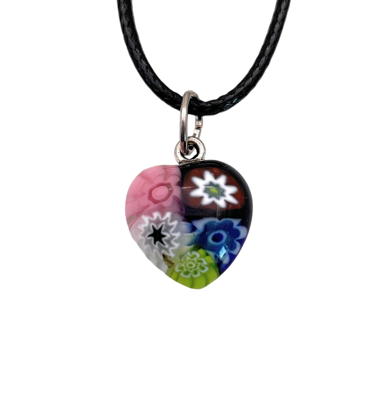 The Murano Heart Pendant, a tiny 1.3cm piece from Murano Passion, features colorful floral patterns in pink, white, blue, and green on its glass surface. It is divided into four sections that each display unique designs and colors and hangs from a black cord. The pendant also includes a Certificate of Authenticity.