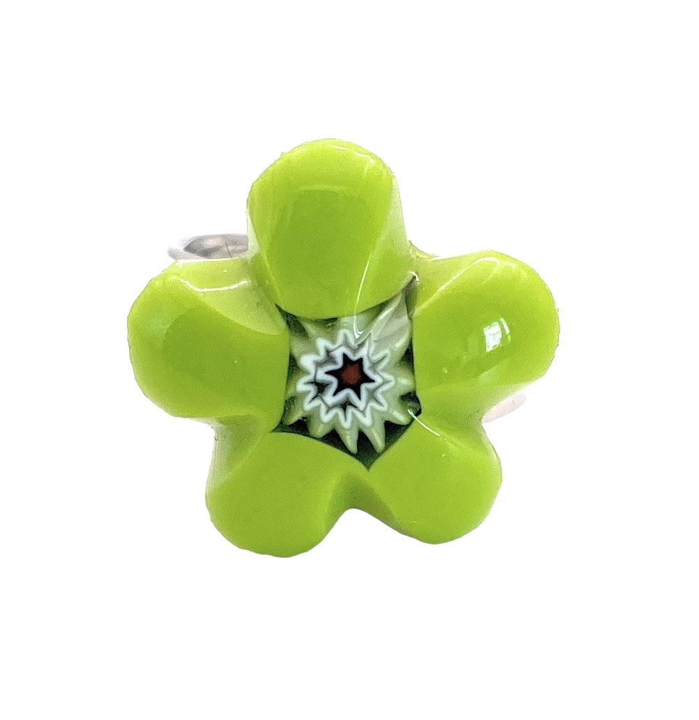 The Murano Glass Ring, Millefiori Flower Ring - 1.8cm by Murano Passion is a captivating piece featuring a green flower-shaped glass design. Handmade in Venice with authentic Murano glass, it showcases a star-like pattern at its center. The intricate Millefiori glass flower design radiates an array of colors against a simple white background.