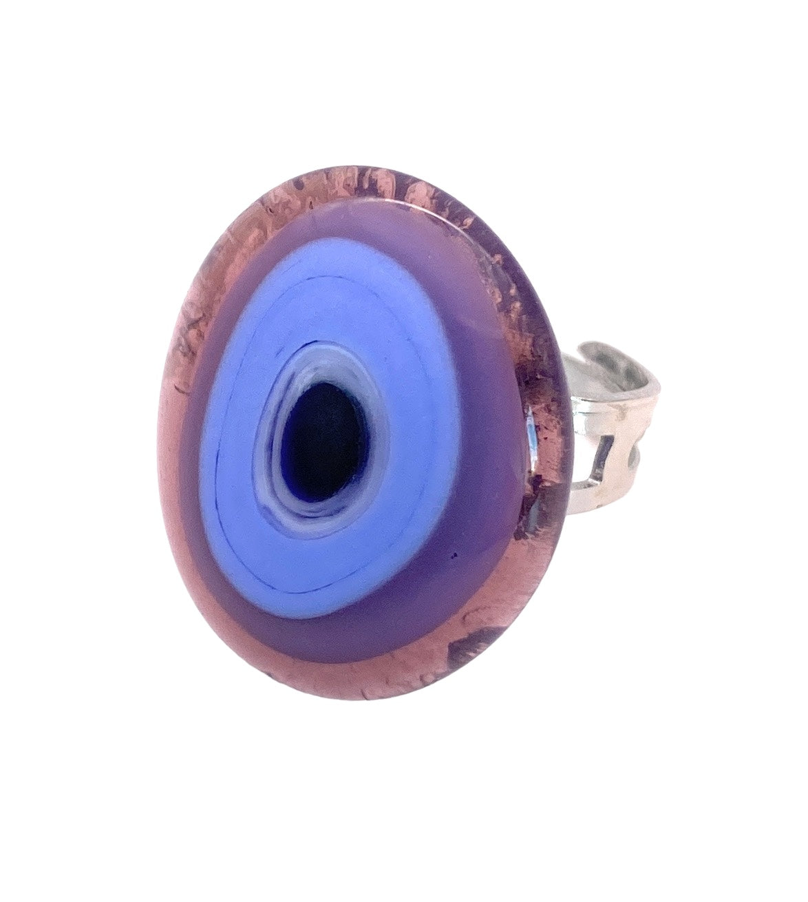 Introducing the Murano Passion Murano Glass Ring, a large abstract shaped piece that serves as a silver statement accessory. Featuring a mesmerizing circular stone adorned with concentric rings in striking purple and blue hues reminiscent of an eye, this exquisite ring is crafted from genuine Murano glass and elegantly set against a white background for added flair.