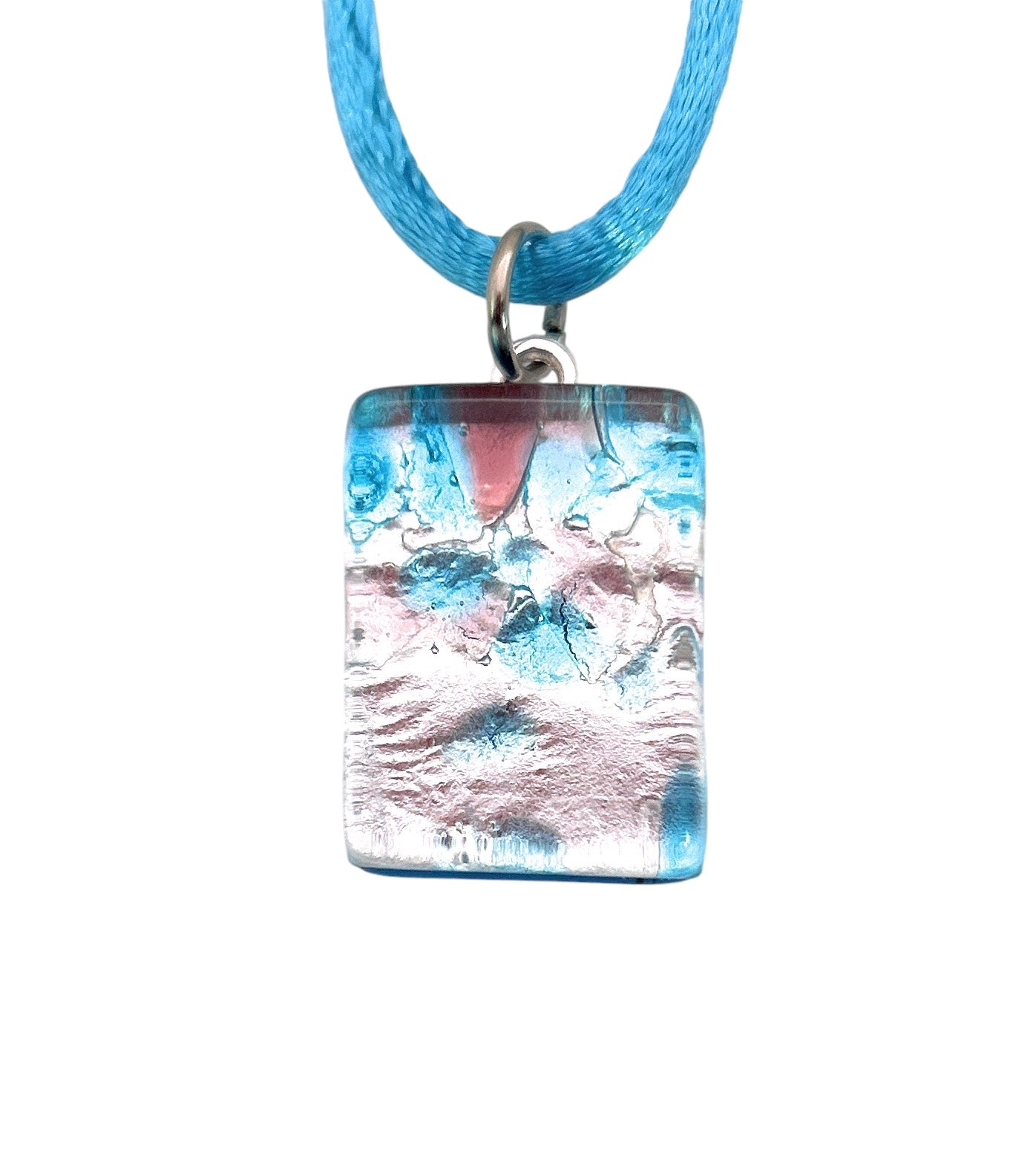 A breathtaking Murano Passion glass pendant, featuring Millefiori flowers on a silver leaf design, is elegantly displayed on a light blue cord necklace.