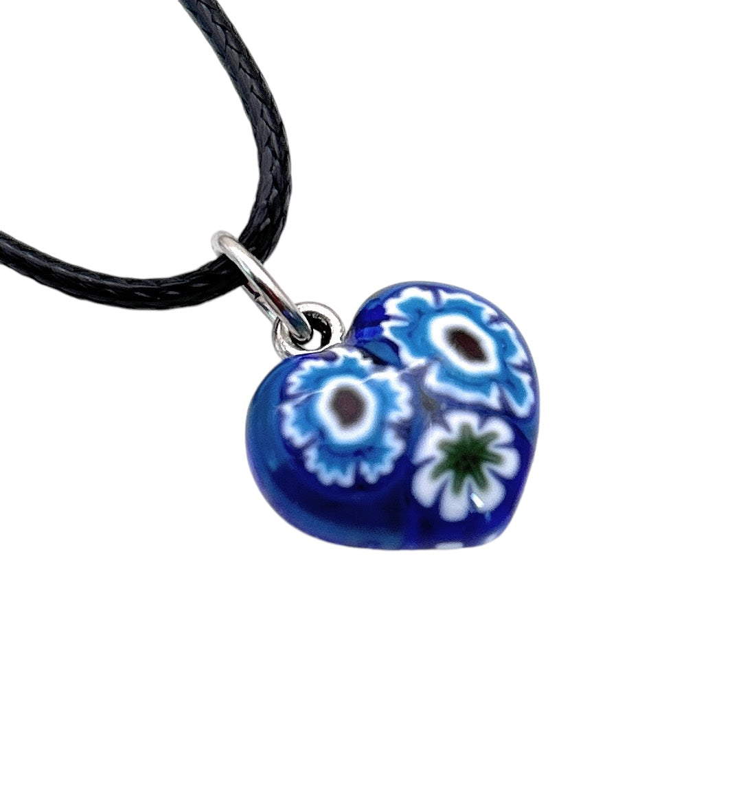 A Murano Heart Pendant by Murano Passion, featuring a blue, white, and green floral pattern, delicately hangs from a black cord. The pendant is a tiny 1.4cm in size.