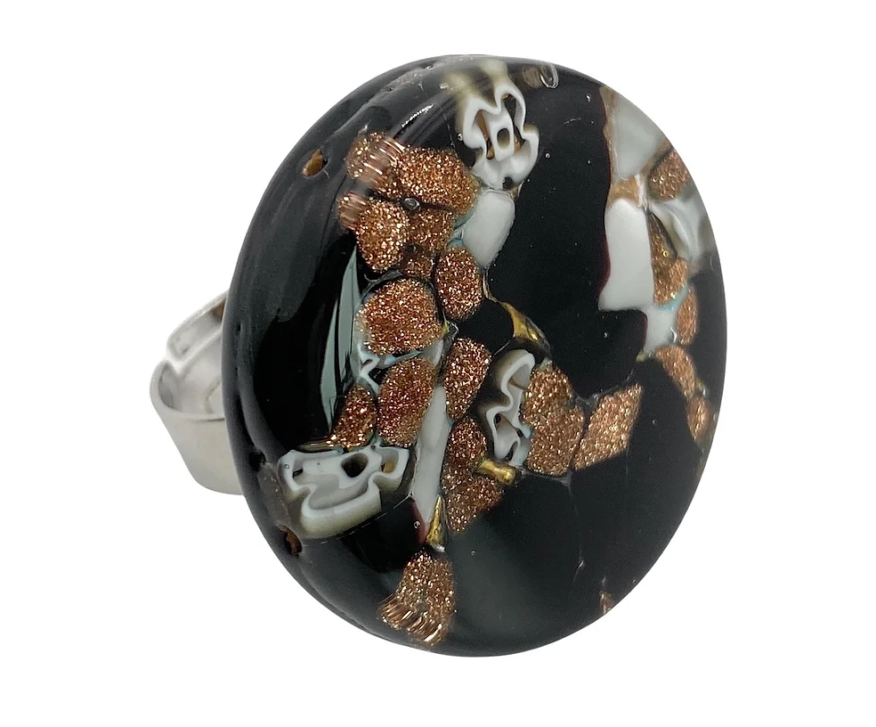 A bold and artistic statement ring crafted by Murano Passion, featuring a large Murano glass stone adorned with abstract patterns resembling a marbled effect, set on a silver band. This handmade piece from Venice beautifully showcases the intricate artistry of Millefiori on Gold Leaf.