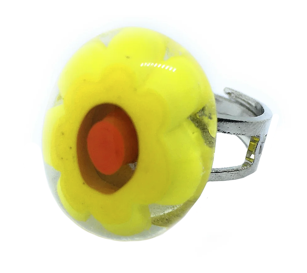 This exquisite Murano Passion ring, meticulously handcrafted in Venice, features a dome-shaped top adorned with a radiant yellow flower design embedded in clear Murano Glass. The orange-red center adds a playful touch to this authentic Millefiori Flower Ring, measuring 2cm x 1.6cm.