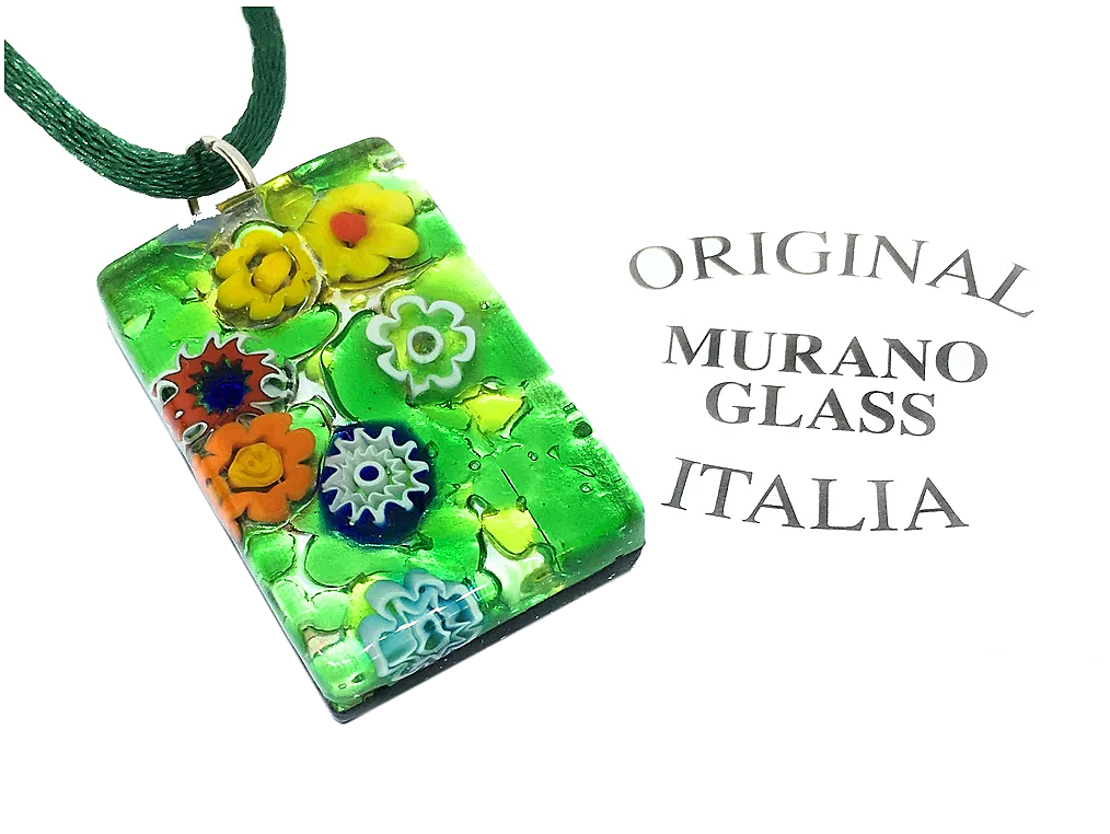 A Murano Glass Pendant from Murano Passion, featuring vibrant Millefiori floral and geometric patterns on a silver leaf backdrop, embodies the charm of Venetian Glass Jewelry. Measuring 3cm by 2cm, it elegantly hangs from a matching green cord. Text on the right reads "Original Murano Glass Italia.