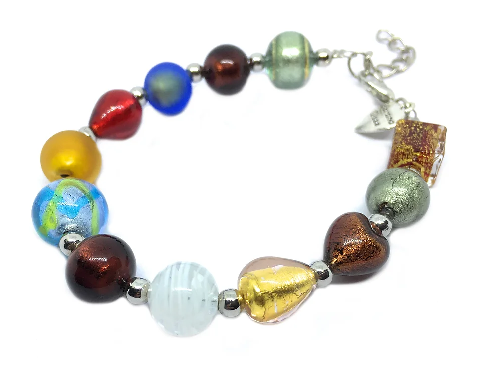 The Murano Glass Bracelet by Murano Passion showcases a lively assortment of beads ranging from 0.5cm to 1cm in blue, red, yellow, and gold. It is enhanced with small silver spacers and includes a clasp adorned with a delicate charm. Each piece is accompanied by a Certificate of Authenticity to guarantee genuine craftsmanship.