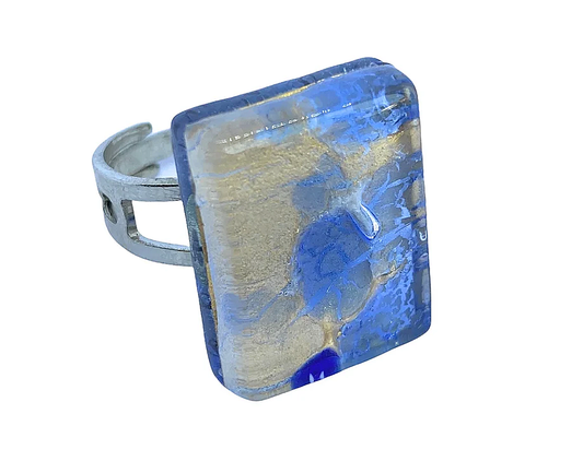 The Murano Glass Ring from My Store features a large, square, clear glass stone adorned with captivating blue, gold, and cream swirls in abstract patterns, expertly handmade in Venice using gold leaf. The ring measures 2cm x 1.5cm and showcases genuine craftsmanship.