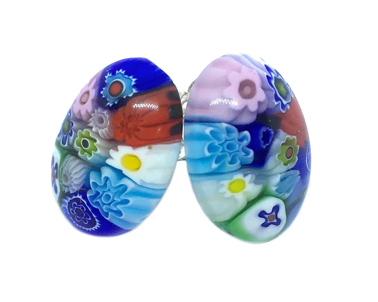 The Murano Passion Murano Glass Earrings, crafted using Millefiori and measuring a dainty 13mm x 8mm, boast intricate floral patterns in vibrant shades of blue, red, green, pink, and white. This handmade jewelry design beautifully showcases overlapping flower shapes in a captivating mosaic style.