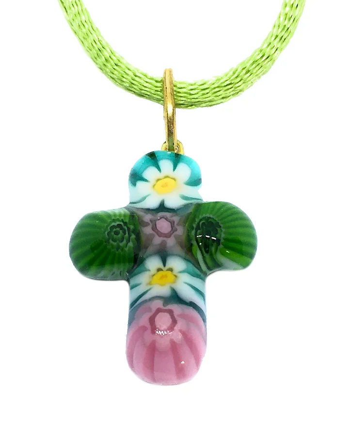 The Murano Glass Cross Pendant by Murano Passion elegantly displays a floral millefiori design on a green cord. This vibrant piece features intricate patterns in green, white, blue, pink, and yellow that resemble flowers and includes a Certificate of Authenticity.