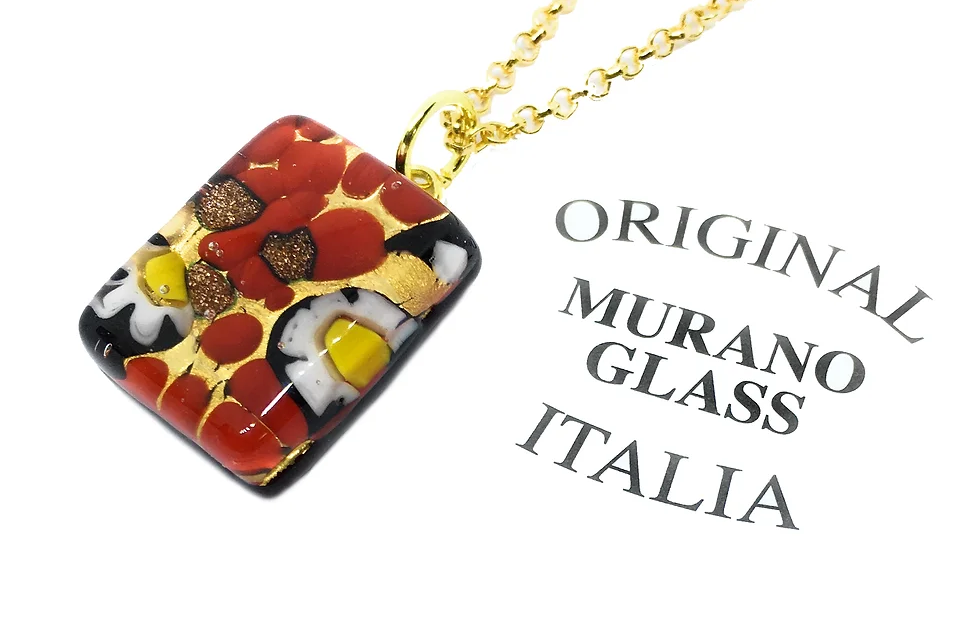 The Millefiori Flower Pendant by Murano Passion, measuring a dainty 2cm x 1.5cm, showcases vibrant red, yellow, white, and gold patterns on a gold chain. The text "Original Murano Glass Italia" is printed beside this exquisite piece, epitomizing the timeless beauty of Murano Glass Jewellery.