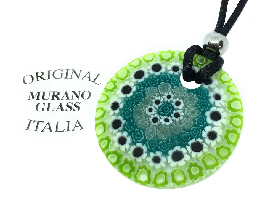 The Murano Glass Pendant from Murano Passion, with a 4cm diameter, showcases intricate green, teal, black, and white floral patterns on a black cord. "Original Murano Glass Italia" is displayed beside it, highlighting the beauty of Millefiori Glass Flowers in authentic Murano craftsmanship.