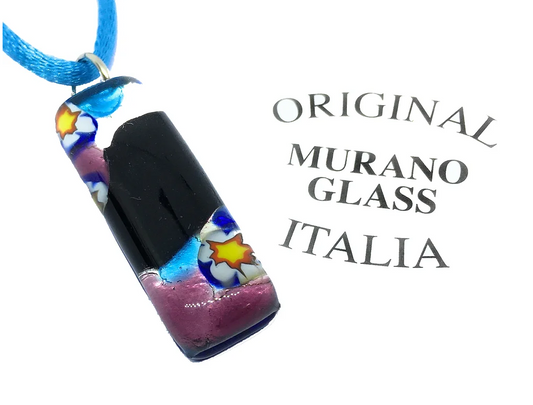 A vibrant Murano Passion pendant, featuring intricate star patterns and showcasing detailed Millefiori pieces, hangs elegantly on a blue cord. This exquisite piece of Venetian jewelry, named the Murano Glass Pendant on Silver Leaf (3cm x 1cm), displays its artistry with the words "Original Murano Glass Italia" proudly beside it.