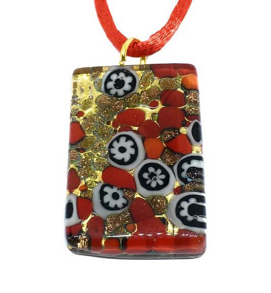 Murano Passion's Murano Glass Pendant, Millefiori Pendant on Gold Leaf, measures 3cm x 2cm and features a vibrant mosaic design with red, black, white, and gold tones. This exquisite piece highlights floral patterns and abstract shapes and is elegantly suspended on a red cord. It also includes a Certificate of Authenticity.