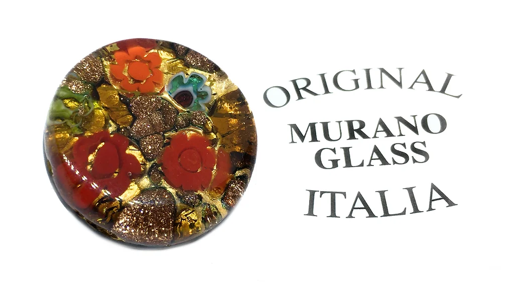 The Murano Passion brooch, measuring 2.4cm, features vibrant red and orange floral patterns against a gold leaf base, embodying Venetian artistic heritage. The text "Original Murano Glass Italia" is elegantly displayed beside this exquisite creation.